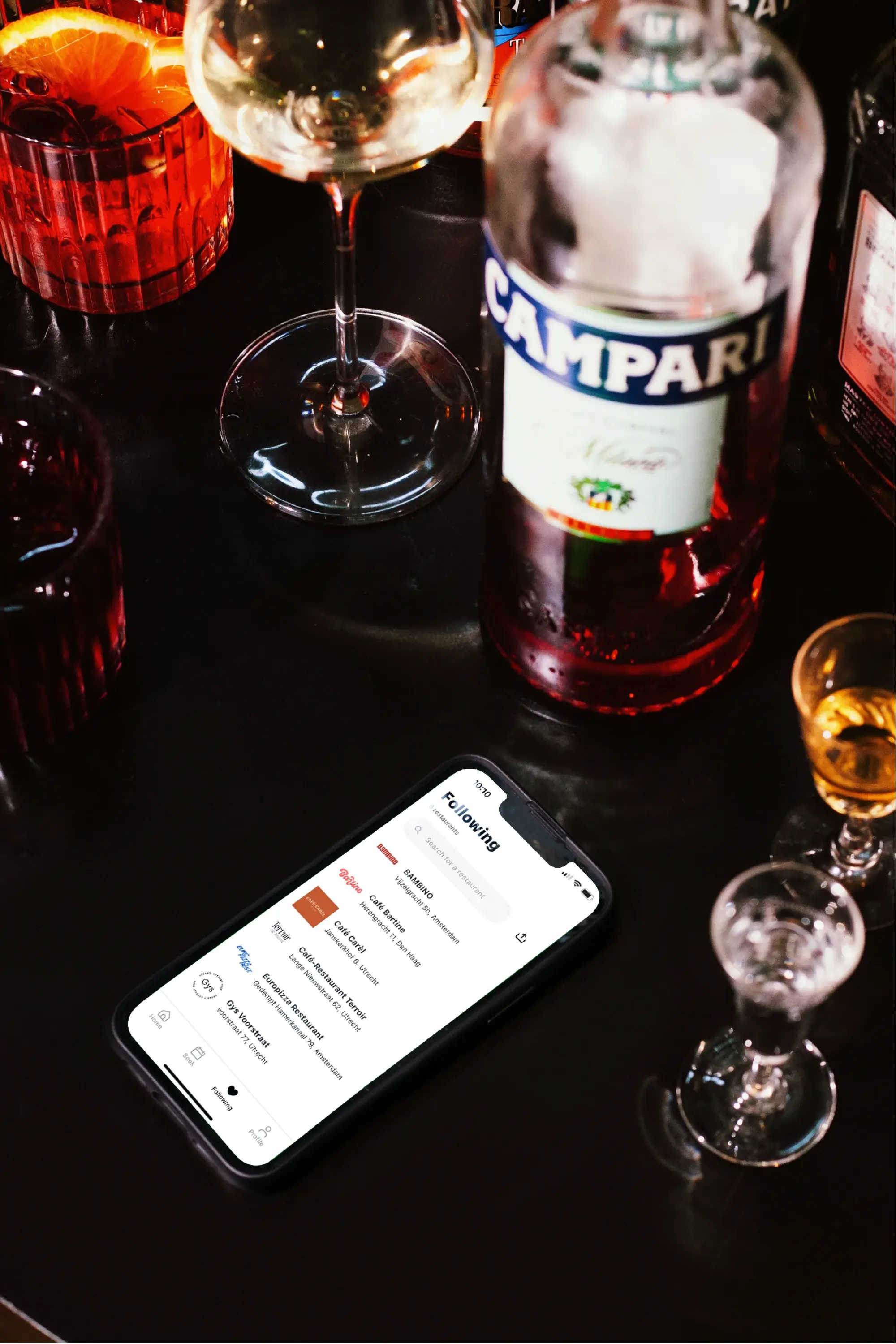 iPhone on table with the Table app opened on the restaurant wishlist page